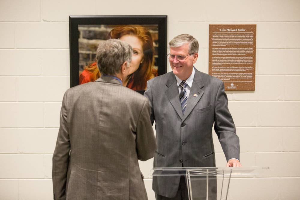 President Haas and Fred Keller shaking hands.
